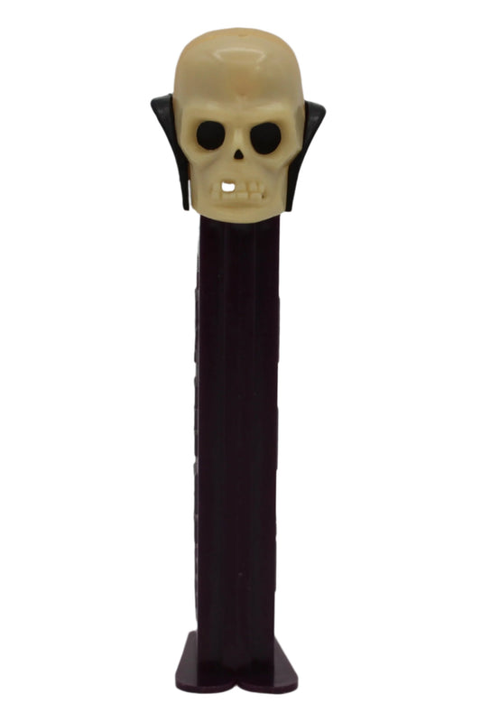 Dr Skull Pez, Skull A, Vampire Pez on Purple Stem, Thin Feet, Red Candy Pusher, Yugoslavia, Loose