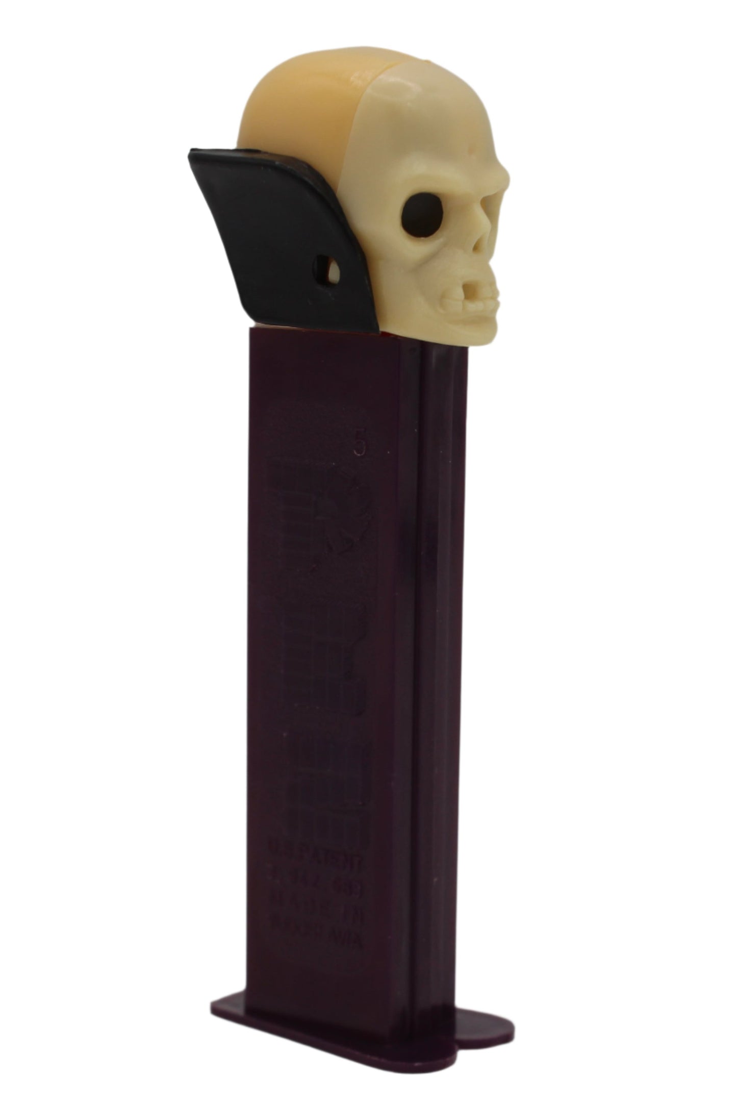 Dr Skull Pez, Skull A, Vampire Pez on Purple Stem, Thin Feet, Red Candy Pusher, Yugoslavia, Loose