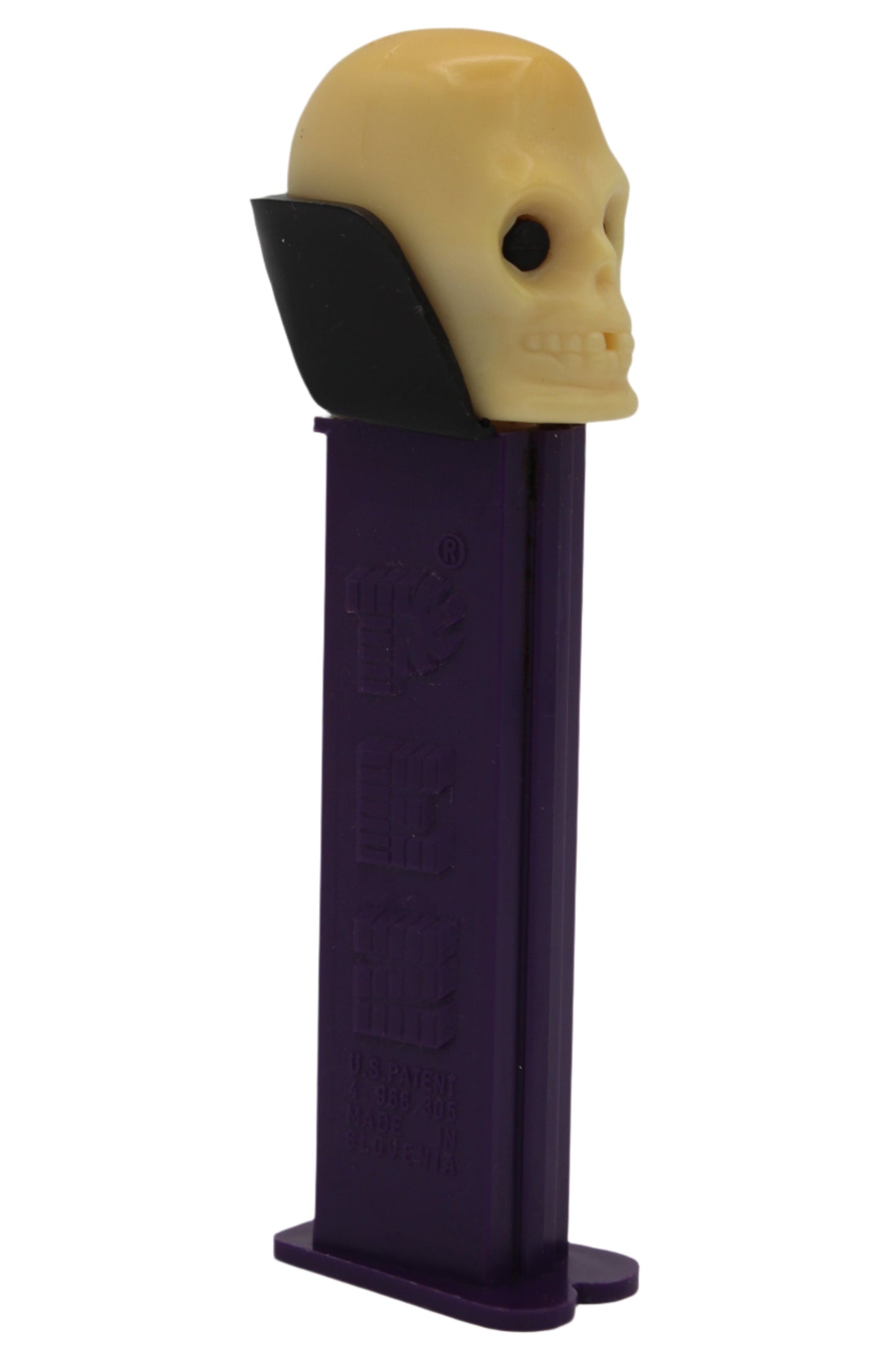 Dr Skull Pez, Skull B, Vampire Pez on Purple Stem, Yellowed Skull, 2002, Slovenia, Loose